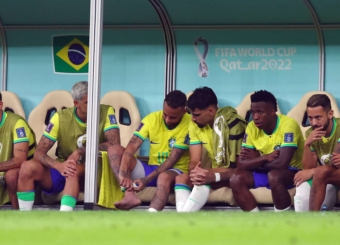 Neymar pictured applying pressure to his right ankle after being substituted off during Brazil's 2-0 win over Serbia at the 2022 World Cup in Qatar